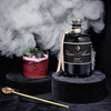 Elixier d&#39;Amour Edition Noire dargestellt mit Cocktail