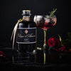 Elixier d&#39;Amour Edition Noire dargestellt mit Cocktail